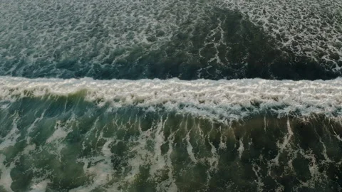 Top down aerial view of giant ocean waves crashing and foaming Stock Footage 150128175