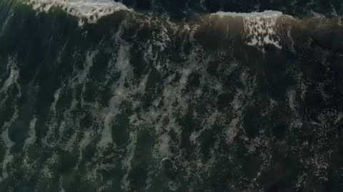 Top down aerial view of giant ocean waves crashing and foaming Stock Footage 150128243