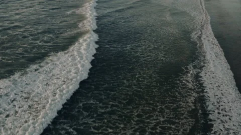 Top down aerial view of giant ocean waves crashing and foaming Stock Footage 150128313