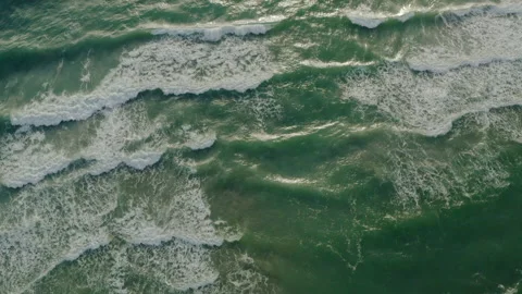 Top down aerial view of giant ocean waves crashing and foaming Stock Footage 150129208
