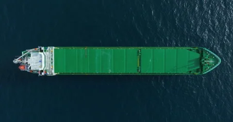 Top down aerial view green large general cargo ship anchored at sea Video stock 262340048