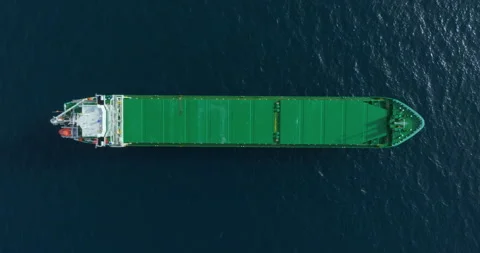 Top down aerial view green large general cargo ship anchored at sea Stockbeeldmateriaal 264166693