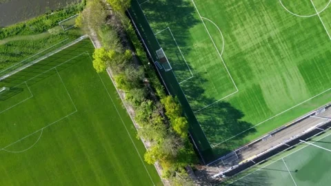 Top-down aerial view of a green sports field with white markings Stock-Footage 308462323