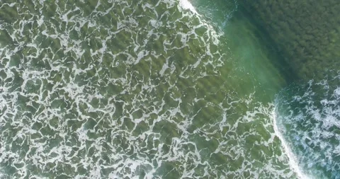 Top down aerial view of green ocean waves highlighting the concept of summe.. Stock-Footage 325675776