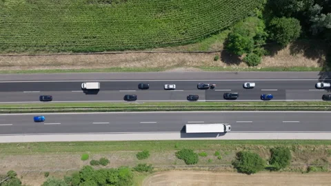 Top-down aerial view of highway with contrasting traffic flow Stock Footage 263378418