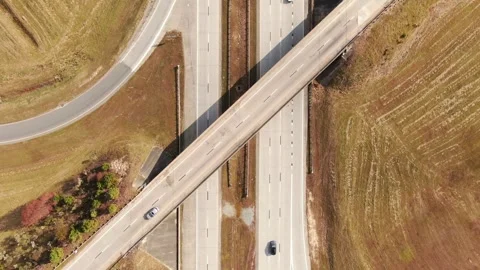 Top Down Aerial View of Highway Traffic and Overpass Bridge Geometry Stock Footage 331215051