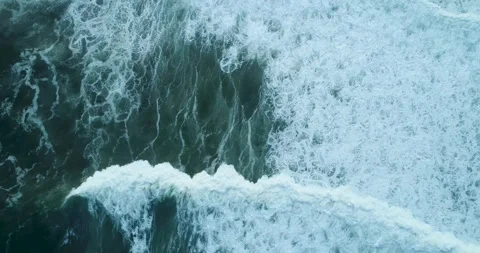 Top down aerial view of a huge breaking wave a lock down shot The Concept o.. Stock Footage 317387381