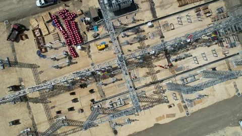 Top-down aerial view of an industrial construction site with cranes Stock Footage 278367594