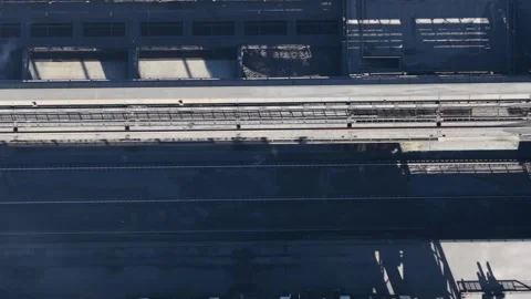 Top down aerial view of industrial conveyor belts and railroad tracks Stock Footage 337447657