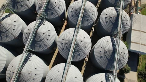 Top down aerial view of industrial grain silos and storage plant Stock Footage 341076997