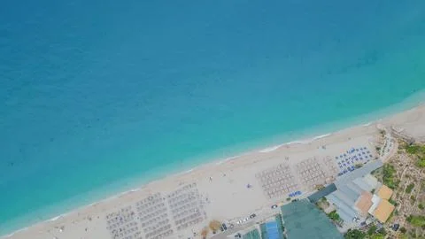 Top down aerial view of Kathisma beach shoreline with sandy coast organized.. 库存照片