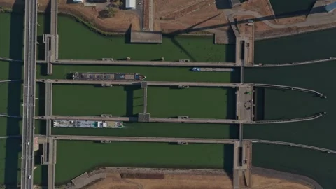 Top down aerial view of krammer locks with cargo ships passing Video stock 342812820