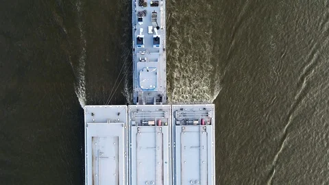 Top Down Aerial View of Large Shipping Barge Powering Up River Video stock 93690754