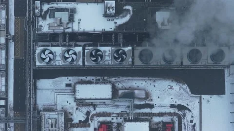 Top down aerial view of a large data center complex during winter. Snow covers Stock Footage 328840165