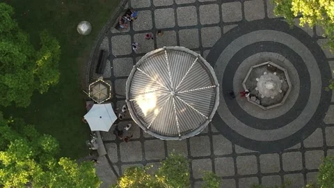 Top down aerial view of lit up Carousel or merry go round in a square Stock Footage 203823560