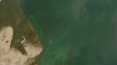 Top Down Aerial View of Lone Boat on Emerald Waters at Lake Achensee Austria Stock Footage 340483079