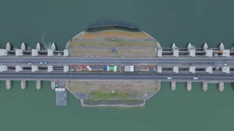 Top down aerial view of the Lorentz Locks on the Afsluitdijk with road traffic Stock Footage 343839123