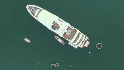 Top down aerial view of luxury super yacht in harbor Stock Footage 85458692