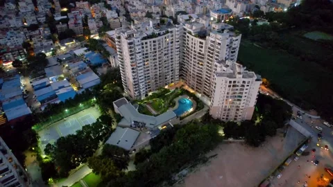 Top down aerial view of luxury apartment complex with pool and tennis court.. Stock Footage 317850540