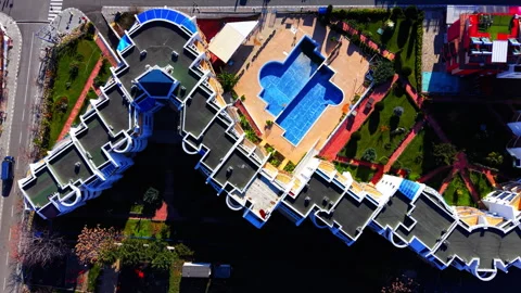 Top down aerial view of a luxury resort with swimming pool Stock Footage 326136912