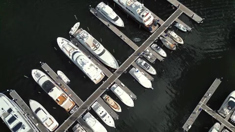 Top-Down Aerial View of Luxury White Yachts Docked at Marina 動画素材 327762074