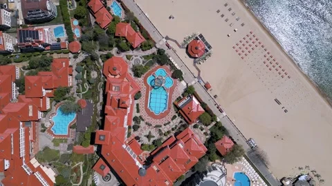 Top down aerial view of luxury beachfront resort hotel with pools Vídeos de archivo 336947097