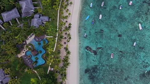 Top Down Aerial View of Luxury Beach Resort and Boats in Le Morne, Mauritius Stock Footage 339508636