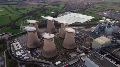 Top-down aerial view of a major industrial power station and cooling towers Stock Footage 339047474