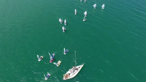 Top-down aerial view of many small yachts training at sea Stock Footage 93572868
