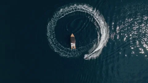 Top down aerial view men on electric surf board making circle Stock Footage 246407438