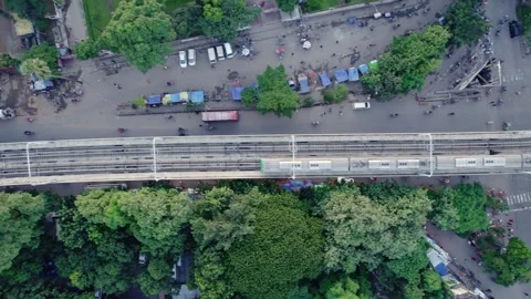 Top-Down Aerial View of Metro Train Over a Busy Dhaka Intersection Stock Footage 338082234