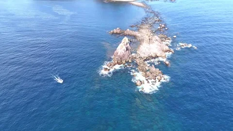 Top Down Aerial View of Mitsuishi Rocks│Manazuru Japan Stock Footage 329057633