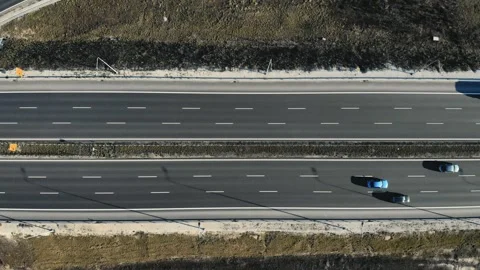 Top Down aerial view of modern transport junction highway with few moving cars Vidéo 132734746