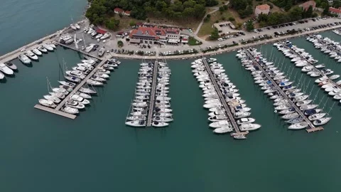 Top-down aerial view of a modern marina with white yachts Stock Footage 322045573