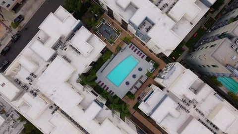 Top Down Aerial View of Modern Apartment Complex Swimming Pool in Los Angeles Stock Footage 339818649