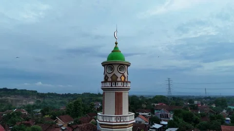 Top Down Aerial View Of A Mosque Tower Against A Cloudy Sky Stock Footage 295983206
