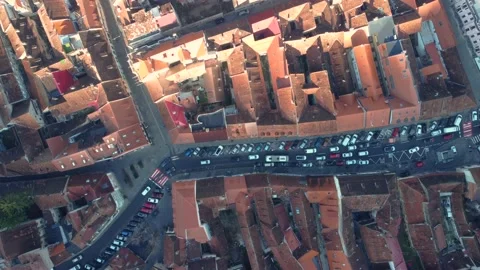 Top down aerial view of a narrow street with cars moving Stock Footage 231201399