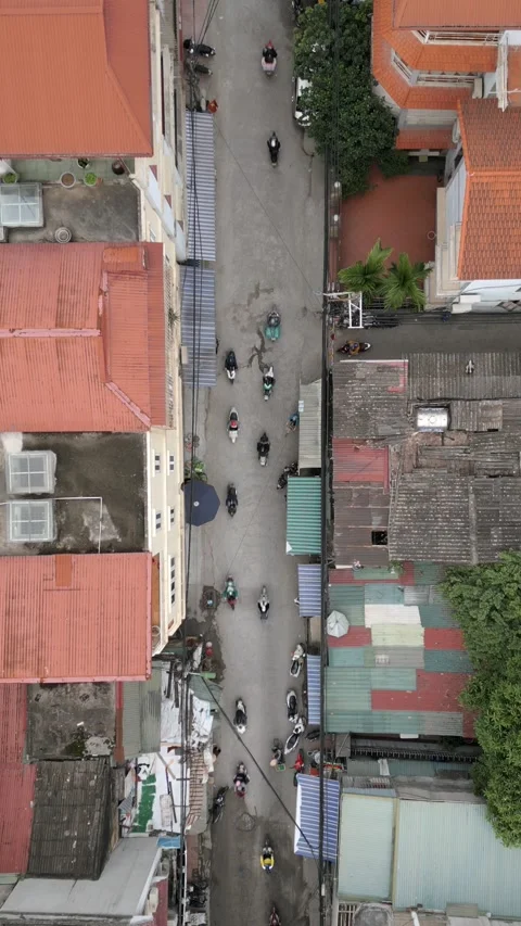 Top-down aerial view of narrow street with motorbike traffic in Hanoi, Vietnam. Stock Footage 310352668