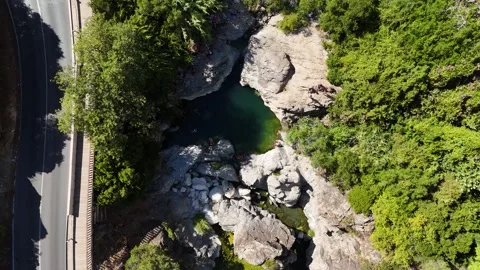 Top down aerial view of natural rock pool in river gorge, Benahavis, Spain Stock Footage 339304822