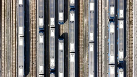 Top down aerial view of numerous passenger metrorail wagons parked on multi.. Stock Footage 333601760