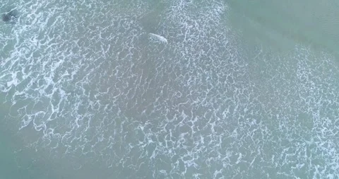 Top Down Aerial View of Ocean Waves on a Beach The Concept of Tranquility Stock-Footage 327814549