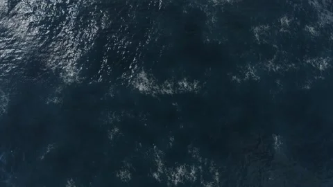 Top Down Aerial View of Ocean Surface with Subtle Waves and Texture Stock Footage 328487806