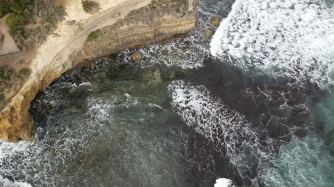 Top down aerial view of ocean cliff and walkway Stock Footage 336004351