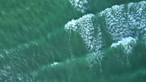 Top-Down Aerial View of Ocean Waves and White Surf Stock-Footage 339399934