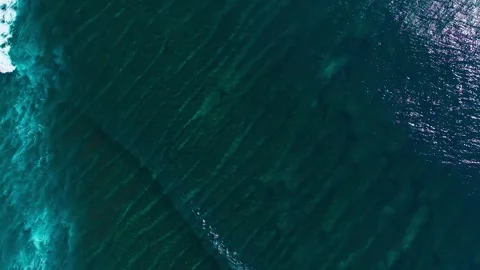 Top Down Aerial View of Ocean Waves Breaking Over Coral Reef Stock Footage 340658859
