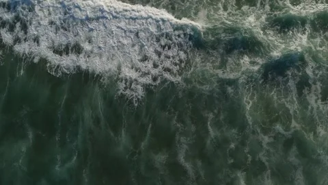 Top-down aerial view of ocean waves crashing with white foam, sea texture Stock Footage 346373654