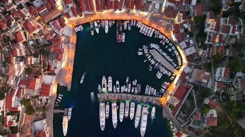 Top down aerial view over Hydra port, Greece revealing a tapestry of lights and  Stock Footage 287651641