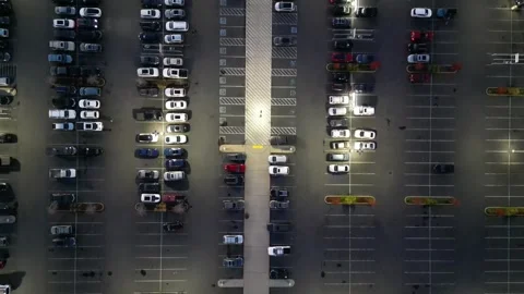 Top-Down Aerial View of Parking Lot with Cars at Dusk Stockbeeldmateriaal 348420486