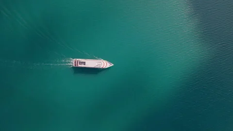 Top Down Aerial View of a Passenger Boat Crossing Lake Achensee Stock Footage 340487844