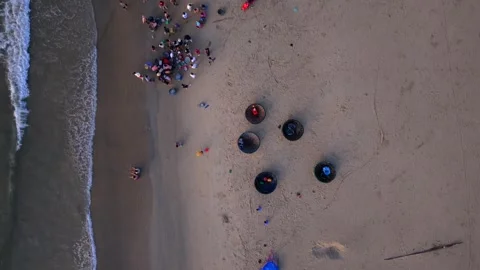 Top down aerial view of people gathering on tropical sandy beach Stock Footage 341265028